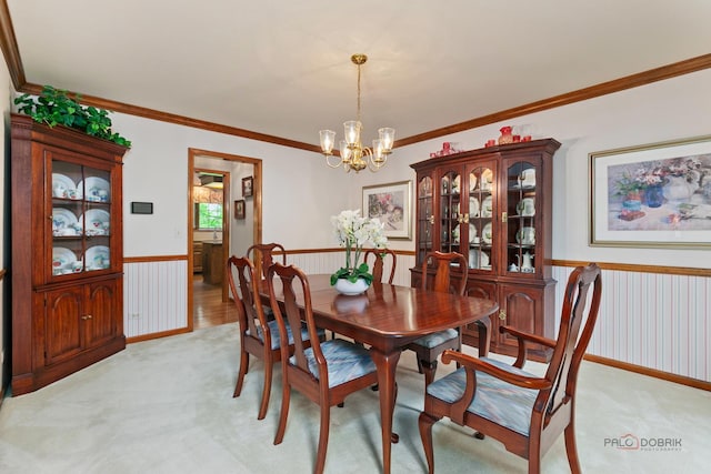 2872 Whispering Oaks Ct, Buffalo Grove, IL 60089 - dining space with a wainscoted wall, a chandelier, light colored carpet, and ornamental molding