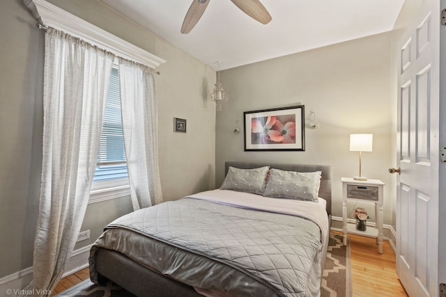 217 Circle Ave, Forest Park, IL 60130 - bedroom featuring multiple windows, wood finished floors, and baseboards
