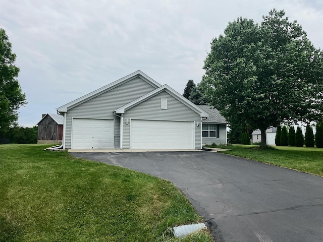 6760 N Summit Dr, Byron, IL 61010 - ranch-style home with a front yard, asphalt driveway, and an attached garage