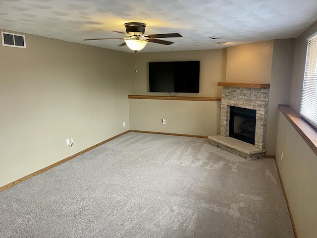 6760 N Summit Dr, Byron, IL 61010 - unfurnished living room with a ceiling fan, light carpet, baseboards, and healthy amount of natural light