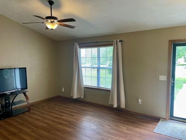 6760 N Summit Dr, Byron, IL 61010 - unfurnished living room with dark wood-type flooring, ceiling fan, and baseboards
