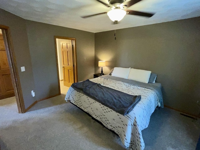 6760 N Summit Dr, Byron, IL 61010 - carpeted bedroom featuring baseboards and a ceiling fan
