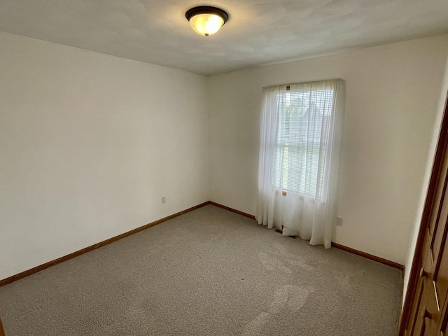 6760 N Summit Dr, Byron, IL 61010 - empty room with light colored carpet and baseboards
