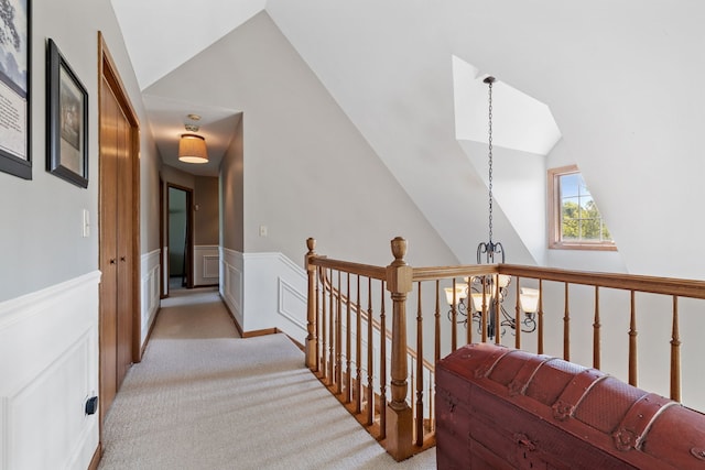 8340 W Monee Manhattan Rd, Monee, IL 60449 - hall with an upstairs landing, light colored carpet, lofted ceiling, and a wainscoted wall