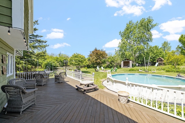 8340 W Monee Manhattan Rd, Monee, IL 60449 - wooden terrace with an outdoor pool, a yard, view of scattered trees, and a shed