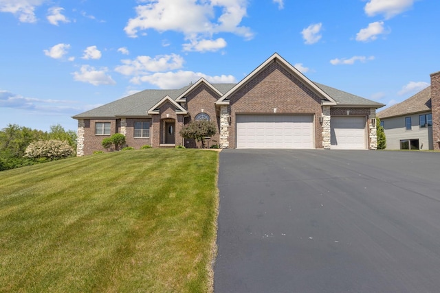 13084 Deer Xing, Roscoe, IL 61073 - view of front of property with a garage, a front yard, brick siding, and asphalt driveway