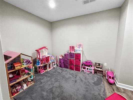 13084 Deer Xing, Roscoe, IL 61073 - playroom with baseboards and wood finished floors