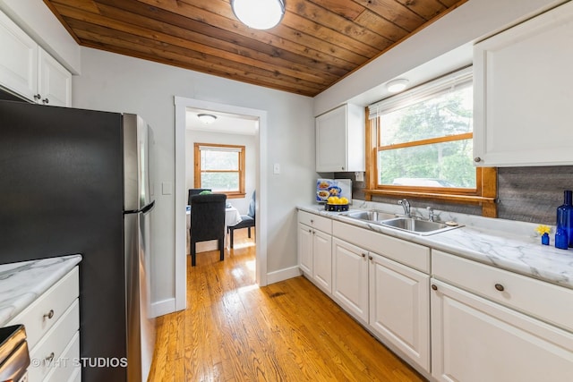 37756 N Cedar Lake Rd, Lake Villa, IL 60046 - kitchen featuring freestanding refrigerator, wood ceiling, white cabinets, and light wood-type flooring