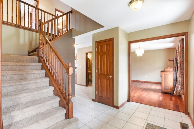 679 Gibbons Dr, New Lenox, IL 60451 - stairs with tile patterned floors and baseboards