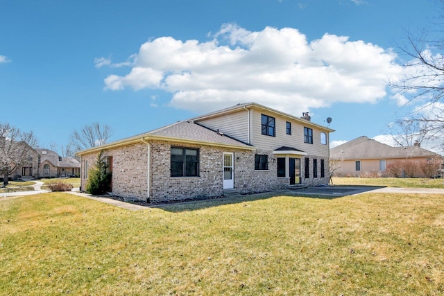 679 Gibbons Dr, New Lenox, IL 60451 - rear view of property with brick siding, a lawn, and a chimney