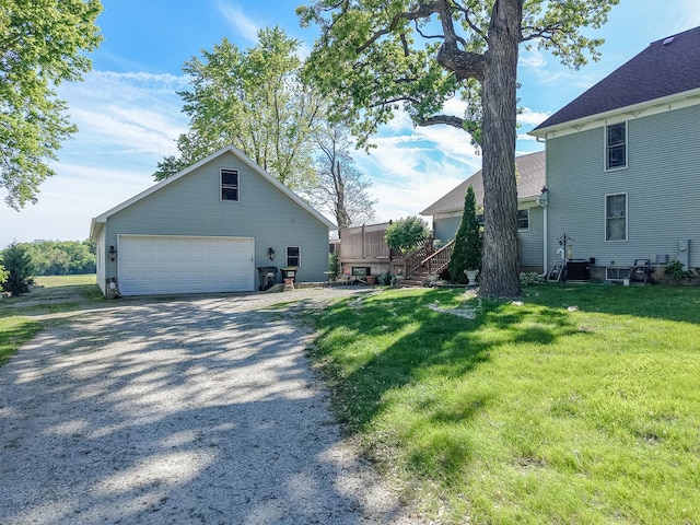 5207 Barnard Mill Rd, Ringwood, IL 60072 - view of property exterior featuring a detached garage, an outbuilding, and a yard