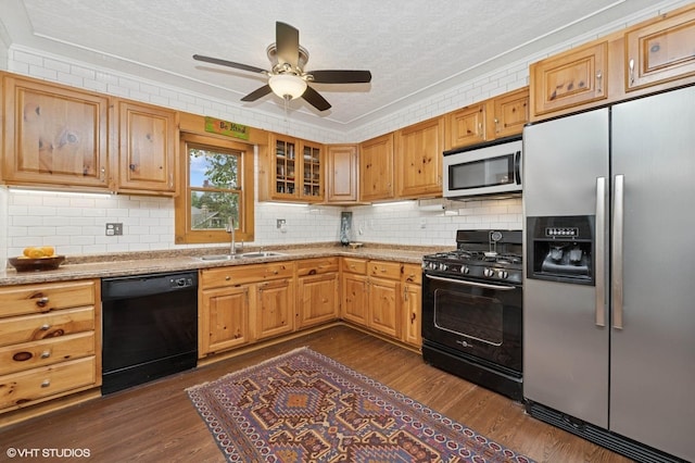 5207 Barnard Mill Rd, Ringwood, IL 60072 - kitchen with black appliances, crown molding, decorative backsplash, dark wood-style flooring, and a ceiling fan