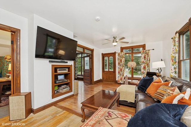 5207 Barnard Mill Rd, Ringwood, IL 60072 - living area featuring light wood finished floors, plenty of natural light, and a ceiling fan