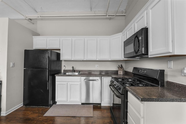 633 S Plymouth Ct Unit 701, Chicago, IL 60605 - kitchen featuring black appliances, dark wood-type flooring, dark countertops, and white cabinets
