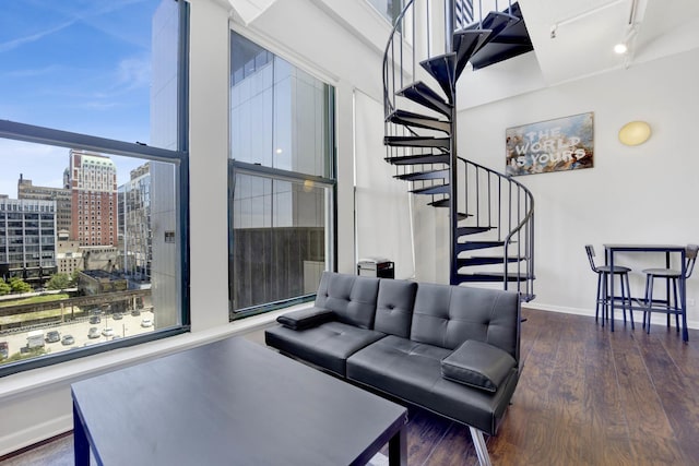 633 S Plymouth Ct Unit 701, Chicago, IL 60605 - living area featuring stairway, a view of city, wood finished floors, and rail lighting
