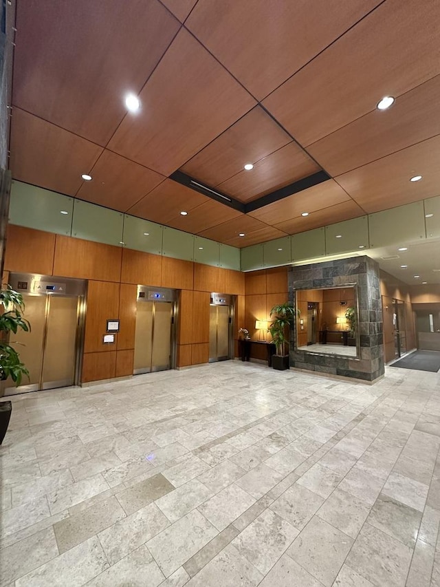 208 W Washington St Unit 1711, Chicago, IL 60606 - building lobby with wooden walls, recessed lighting, and wood ceiling