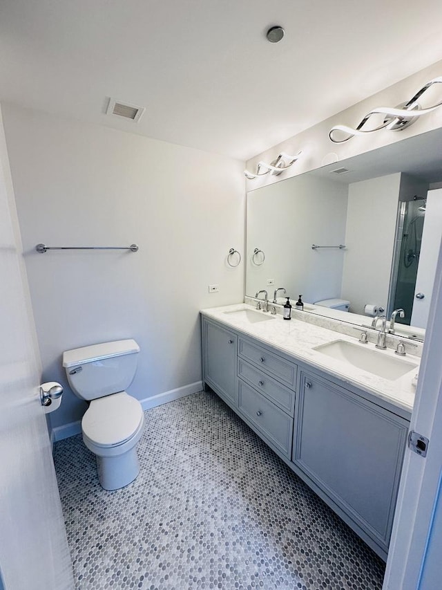 208 W Washington St Unit 1711, Chicago, IL 60606 - bathroom with toilet, double vanity, baseboards, and an enclosed shower