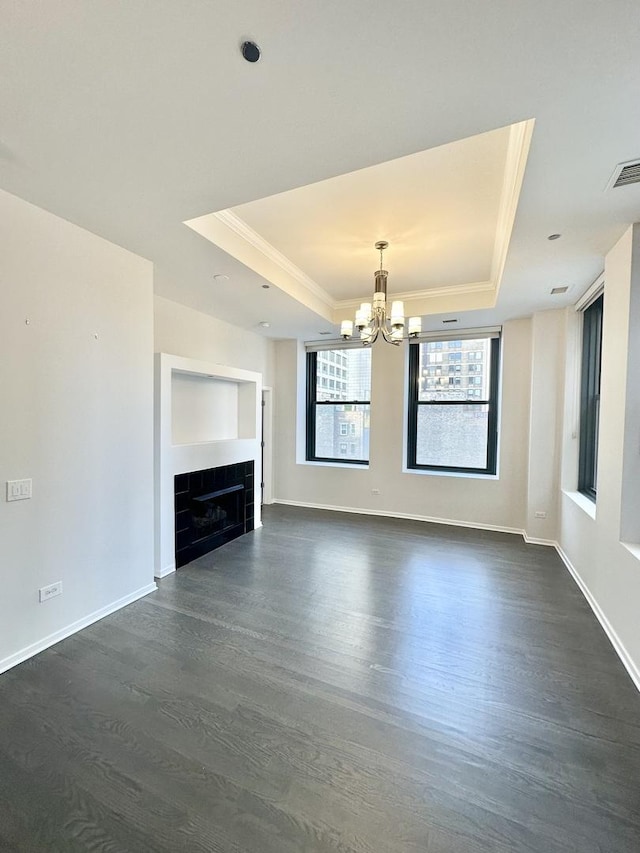 208 W Washington St Unit 1711, Chicago, IL 60606 - unfurnished living room with a raised ceiling, a chandelier, dark wood-style floors, and crown molding