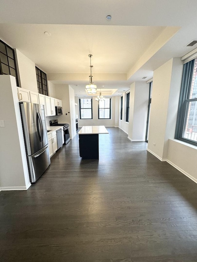 208 W Washington St Unit 1711, Chicago, IL 60606 - kitchen featuring stainless steel appliances, open floor plan, a center island, dark wood-style flooring, and plenty of natural light