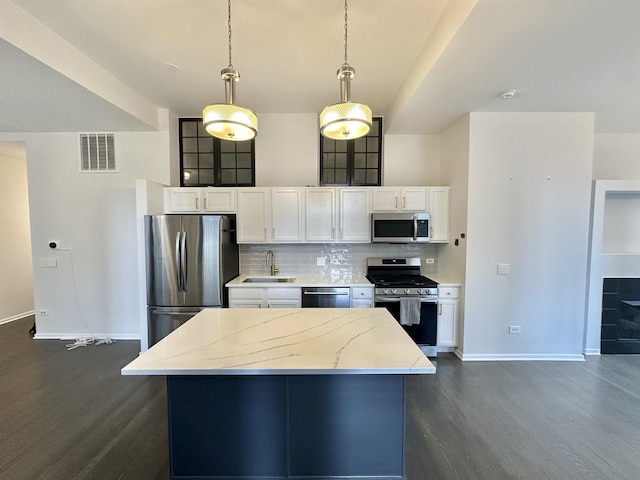 208 W Washington St Unit 1711, Chicago, IL 60606 - kitchen with stainless steel appliances, dark wood-style flooring, baseboards, white cabinetry, and light stone counters