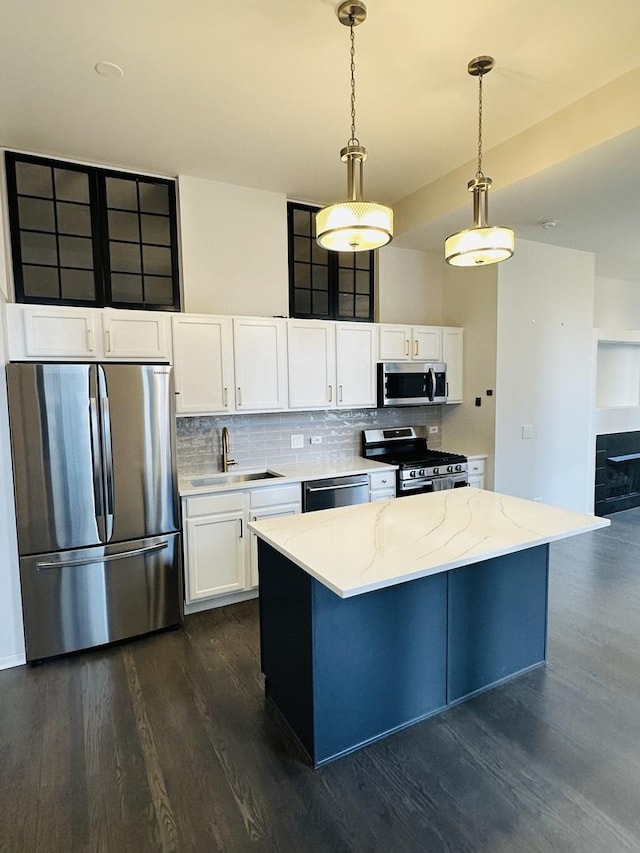 208 W Washington St Unit 1711, Chicago, IL 60606 - kitchen featuring appliances with stainless steel finishes, a sink, dark wood-style flooring, and white cabinetry