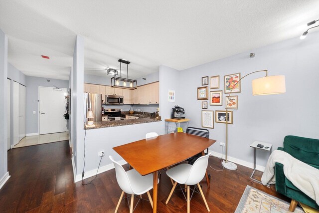 512 N Mcclurg Ct Unit 705, Chicago, IL 60611 - dining room featuring wood finished floors and baseboards