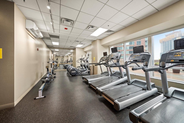 512 N Mcclurg Ct Unit 705, Chicago, IL 60611 - workout area with a wall mounted air conditioner, a drop ceiling, and track lighting
