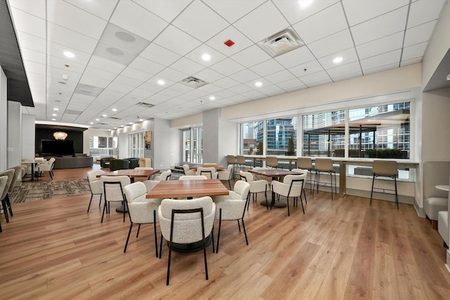 512 N Mcclurg Ct Unit 705, Chicago, IL 60611 - dining room featuring light wood-style flooring and a paneled ceiling