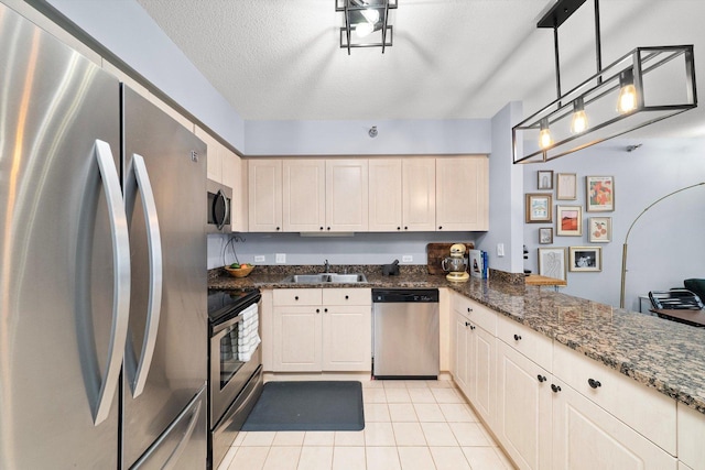 512 N Mcclurg Ct Unit 705, Chicago, IL 60611 - kitchen with stainless steel appliances, light tile patterned flooring, a peninsula, dark stone counters, and pendant lighting