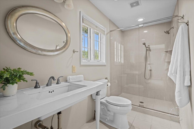 705 Meadows Rd, Geneva, IL 60134 - full bathroom featuring toilet, a shower stall, tile patterned flooring, and a sink