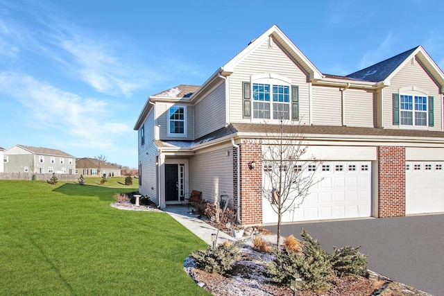 8506 Stillwater Rd, Wonder Lake, IL 60097 - back of house featuring a garage, a lawn, brick siding, and a shingled roof