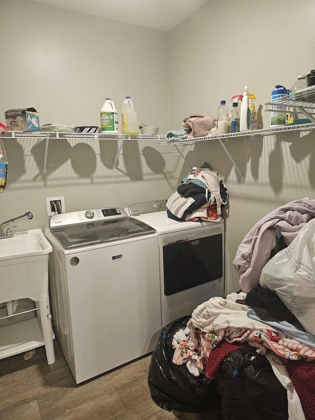 6321 Aspen Ln, Wonder Lake, IL 60097 - laundry room with washer and clothes dryer and wood finished floors
