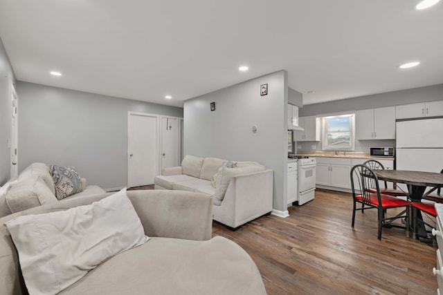 1013 Oakwood Dr, Round Lake Beach, IL 60073 - living area featuring dark wood-style floors and recessed lighting