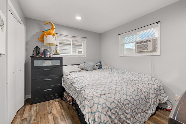 1013 Oakwood Dr, Round Lake Beach, IL 60073 - bedroom with a closet, wood finished floors, cooling unit, and recessed lighting