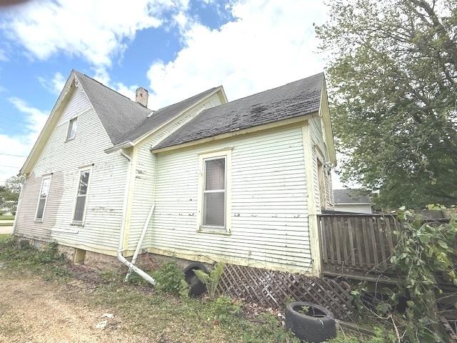 903 S Division Ave, Polo, IL 61064 - view of home's exterior featuring a chimney