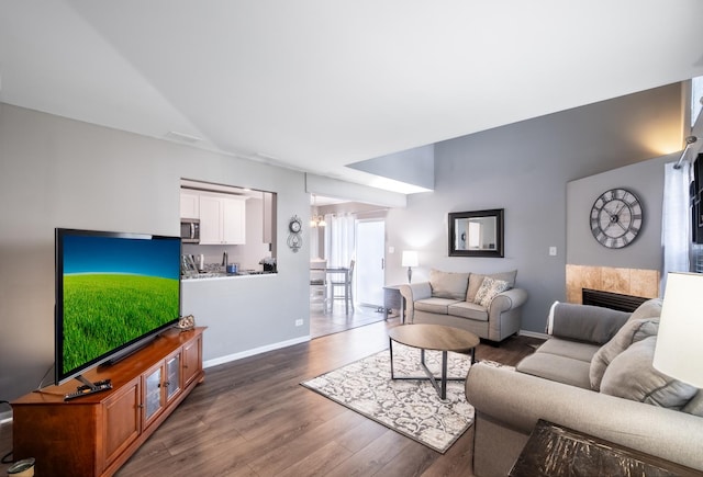 5239 Diamond Dr Unit B, Oak Forest, IL 60452 - living area featuring wood finished floors, a fireplace, and baseboards