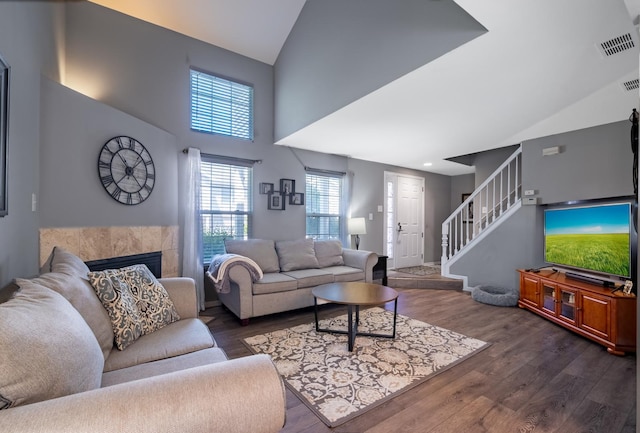 5239 Diamond Dr Unit B, Oak Forest, IL 60452 - living area with high vaulted ceiling, wood finished floors, stairway, and a tiled fireplace