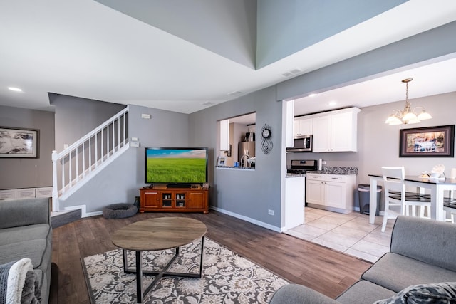 5239 Diamond Dr Unit B, Oak Forest, IL 60452 - living room featuring light wood finished floors, stairs, a chandelier, baseboards, and recessed lighting