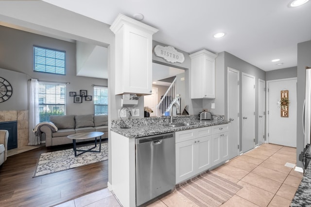 5239 Diamond Dr Unit B, Oak Forest, IL 60452 - kitchen with appliances with stainless steel finishes, open floor plan, white cabinets, light stone counters, and a sink