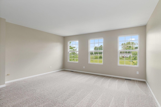 101 E Robinson Ave, Cortland, IL 60112 - spare room with baseboards and light carpet
