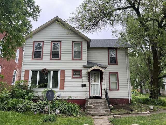 view of front of home with roof with shingles