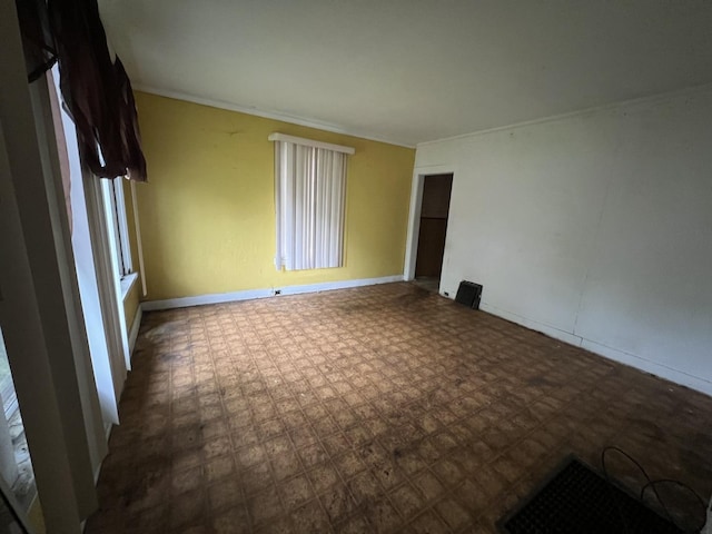 empty room featuring baseboards