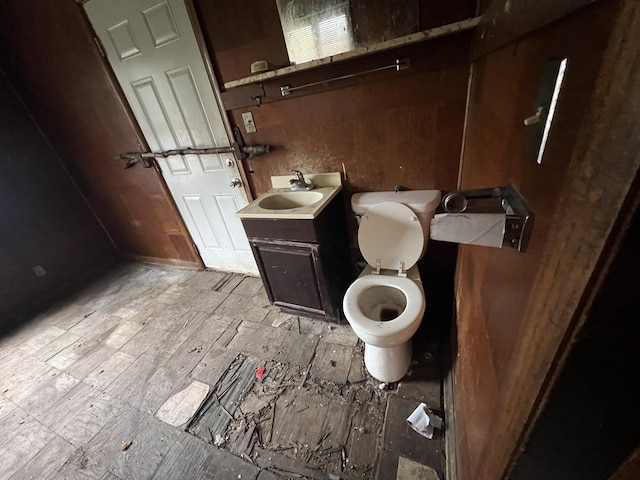half bath featuring toilet and vanity