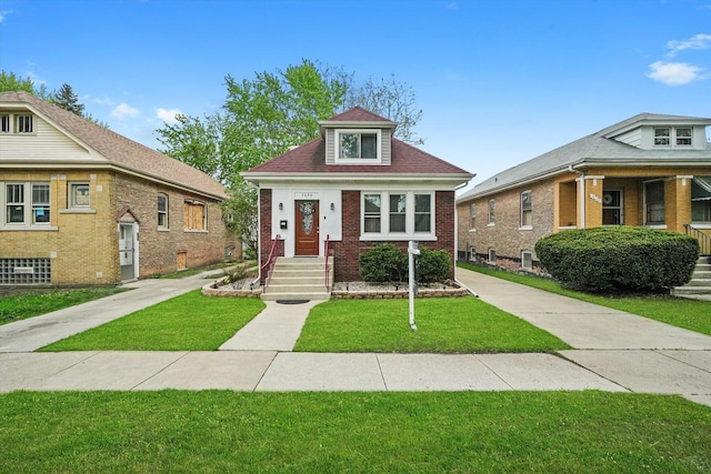 7050 26th Pkwy, Berwyn, IL 60402 - bungalow with a front yard and brick siding