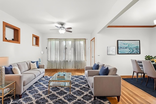 7050 26th Pkwy, Berwyn, IL 60402 - living room featuring wood finished floors, ceiling fan, and baseboards
