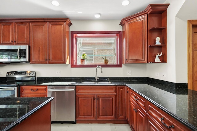 7050 26th Pkwy, Berwyn, IL 60402 - kitchen with appliances with stainless steel finishes, a sink, open shelves, dark stone countertops, and light tile patterned flooring
