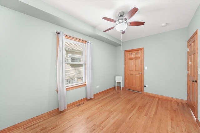 7050 26th Pkwy, Berwyn, IL 60402 - unfurnished bedroom featuring light wood finished floors, baseboards, and ceiling fan