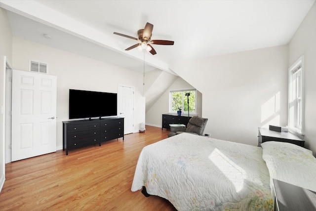 7050 26th Pkwy, Berwyn, IL 60402 - bedroom with light wood-type flooring, lofted ceiling, a ceiling fan, and baseboards