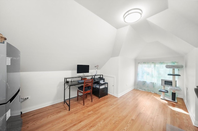 7050 26th Pkwy, Berwyn, IL 60402 - home office with wood finished floors, baseboards, and vaulted ceiling