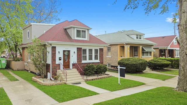 7050 26th Pkwy, Berwyn, IL 60402 - bungalow featuring brick siding and a front lawn
